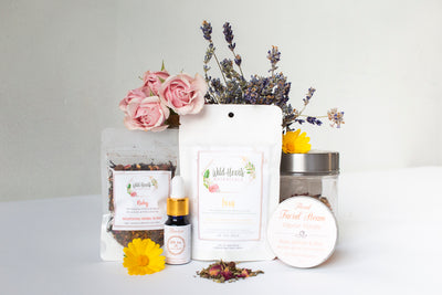 Botanical Wellness Box; 4 herbal skincare and wellness tea products. Ruby Nourishing Herbal Blend, Focus Blend, Floral Facial Steam, Revive Botanical Face Serum, gift box